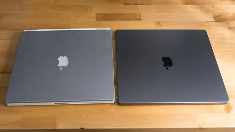 MacBook Pro space gray and MacBook Pro silver side by side on a table