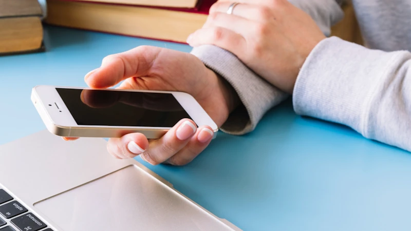 A man with an iPhone in his hands changing its name